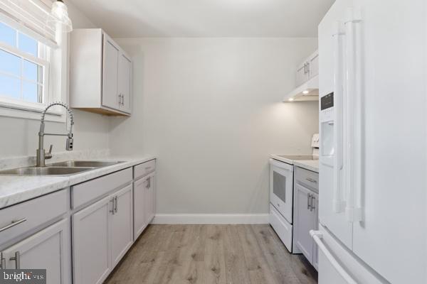 3496 Fox Ridge Court Dover, PA 17315 - Photo 12 of 35 a kitchen with a sink cabinets and a wooden floor