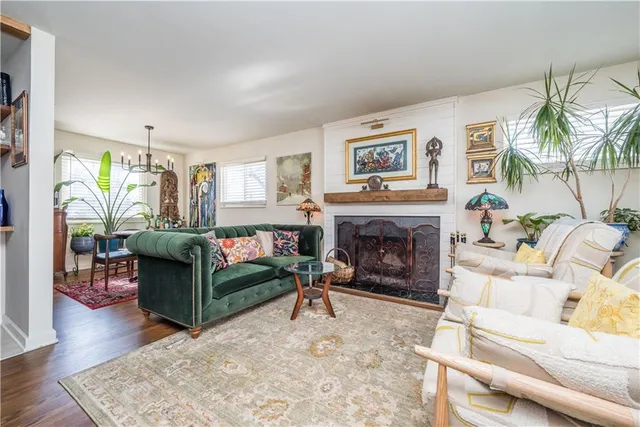 a living room with furniture fireplace and flat screen tv