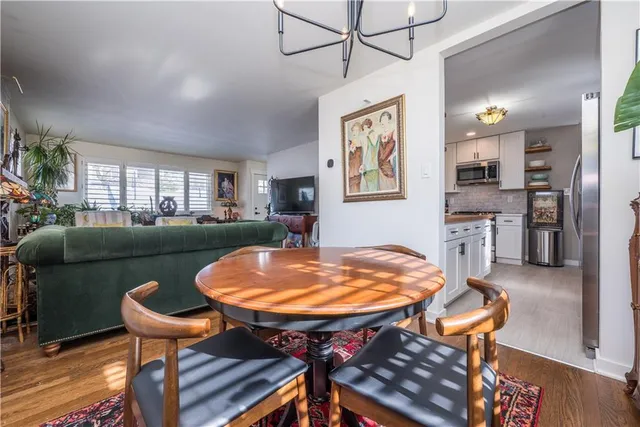 a kitchen with stainless steel appliances granite countertop a sink and cabinets