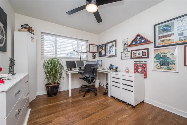 a view of bedroom with furniture and wooden floor