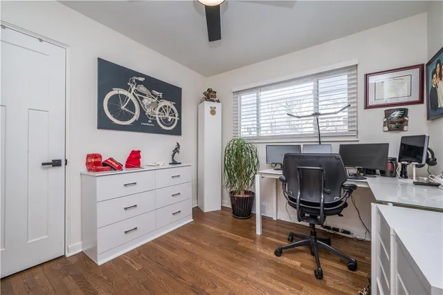 a bedroom with a bed and a dresser in it
