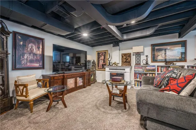 a room with lots of wooden furniture and windows