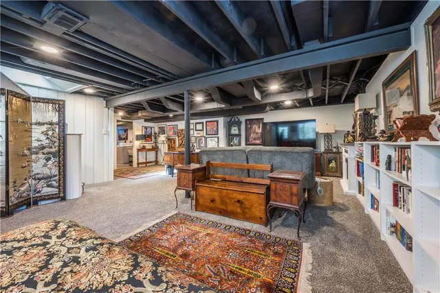 a room with lots of wooden furniture and a chandelier