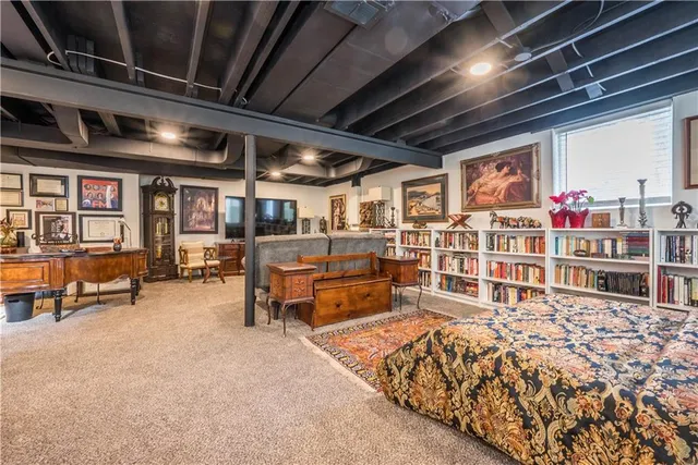 a bed room with a bed and a book shelf