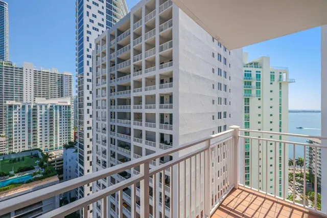 a view of a balcony with a couple of buildings