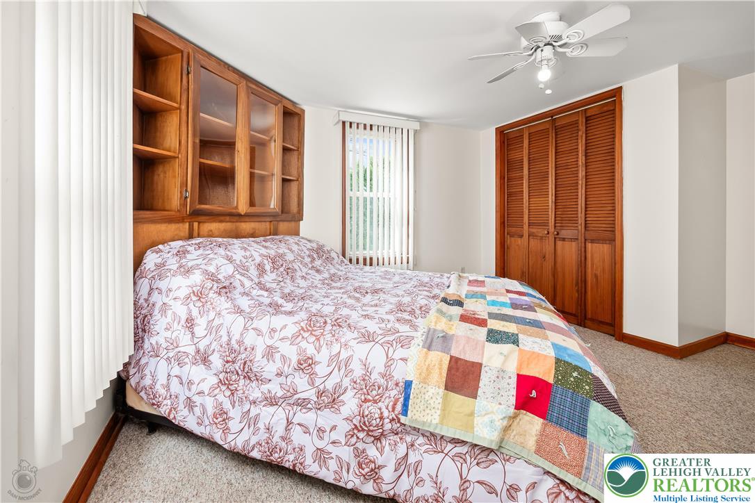 7309 Bell Gate Road Coopersburg, PA 18036 - Photo 27 of 58 a bedroom with a bed and a window