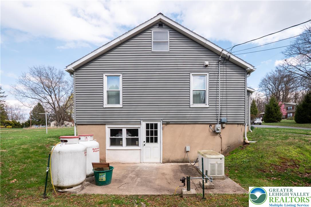 7309 Bell Gate Road Coopersburg, PA 18036 - Photo 7 of 46 Walk-out basement with propane tanks and generator
