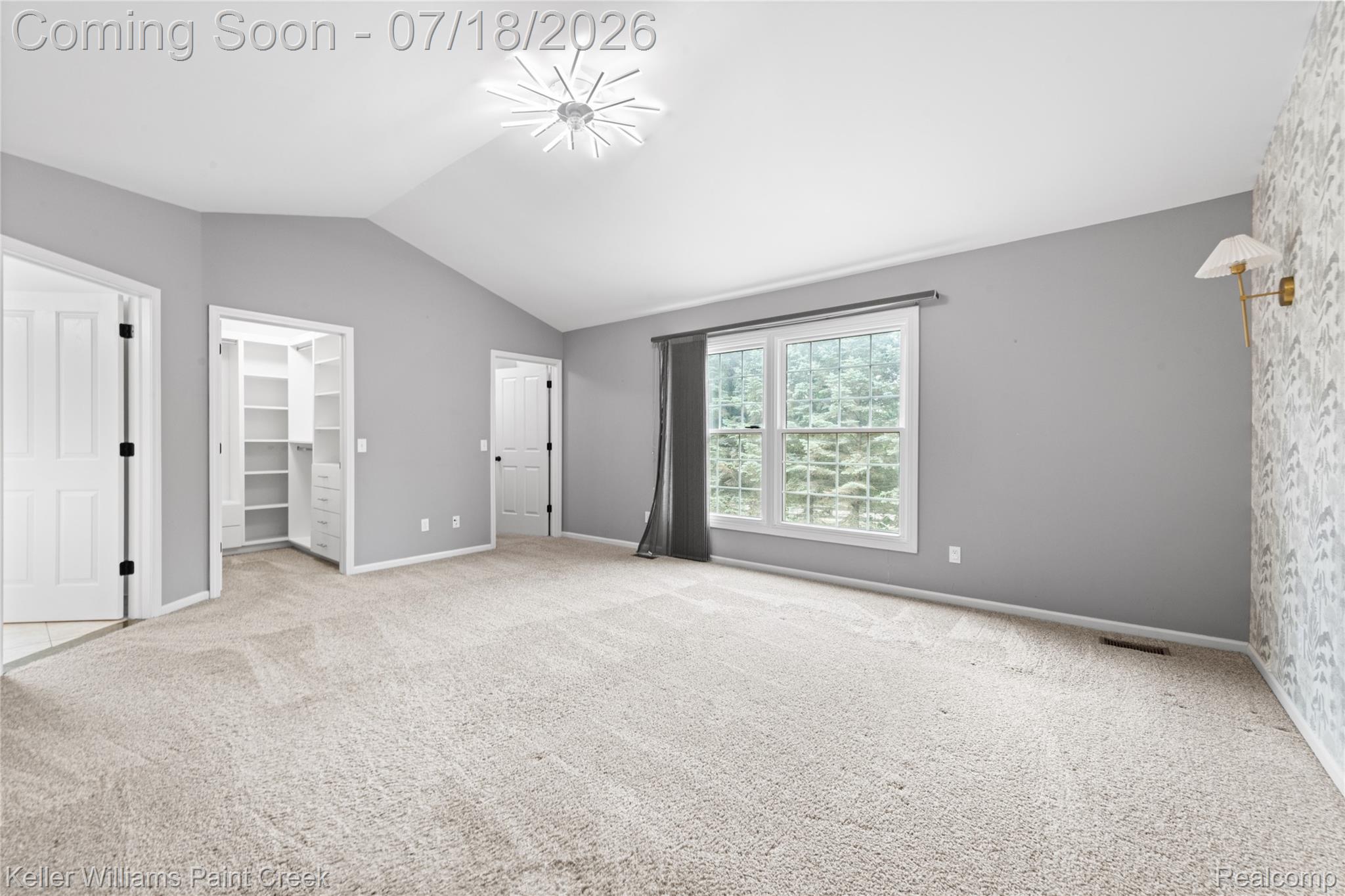 4230 Holly Lane Rochester, MI 48306 - Photo 27 of 64 Spacious room featuring vaulted ceilings and neutral-toned carpeting