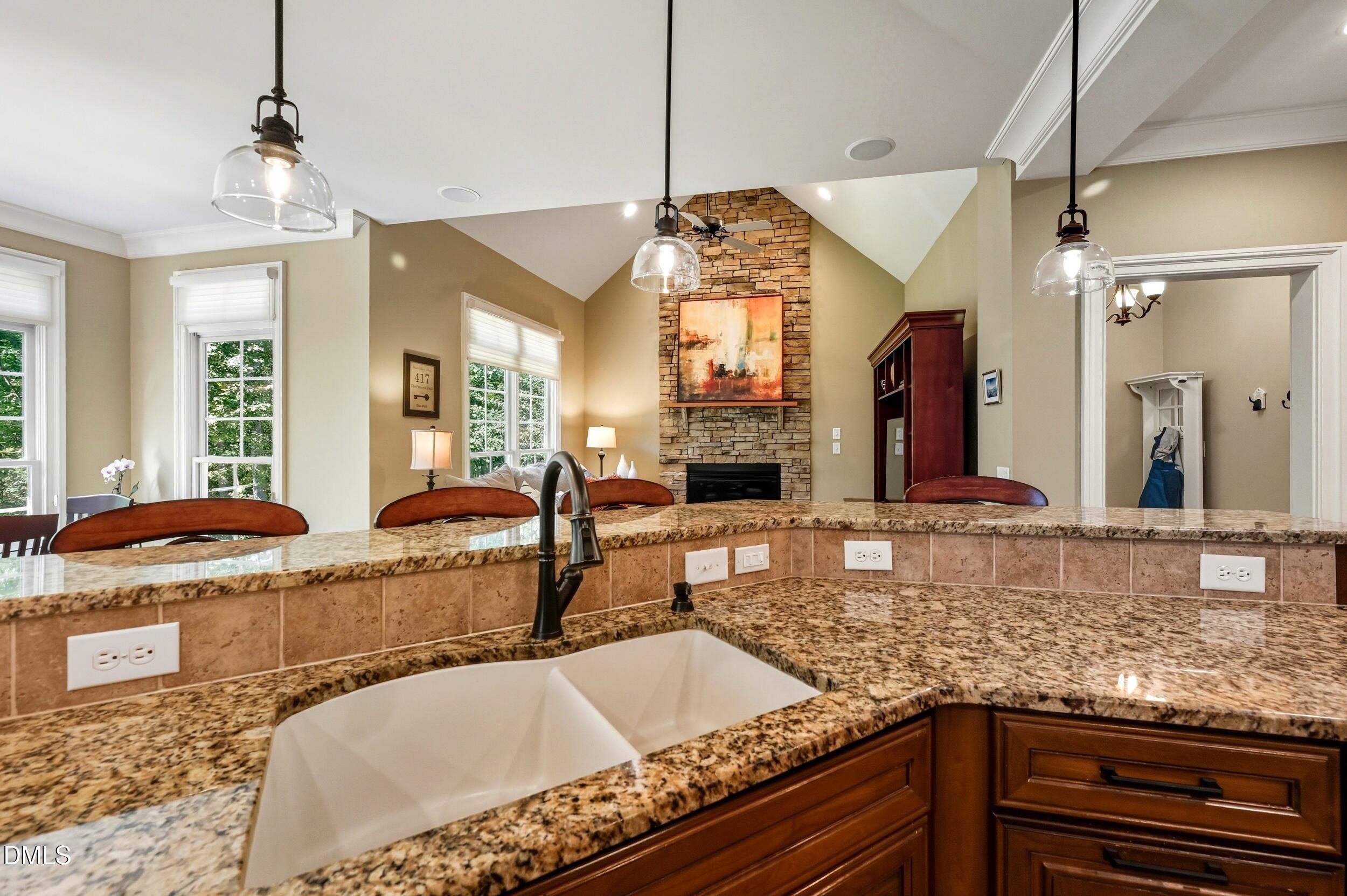 417 The Preserve Trail Chapel Hill, NC 27517 - Photo 22 of 83 a large kitchen with granite countertop a sink and a stove