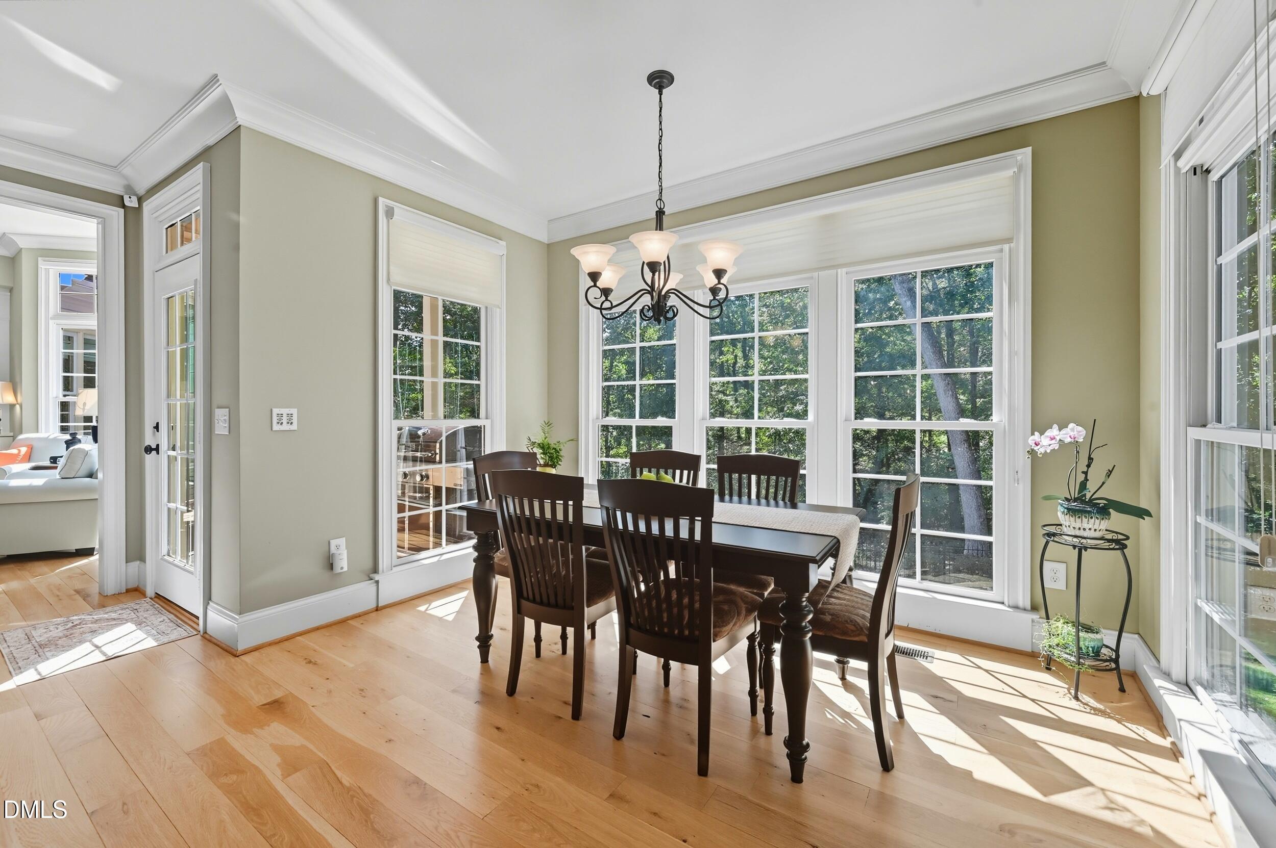 417 The Preserve Trail Chapel Hill, NC 27517 - Photo 24 of 83 a view of a dining room with furniture window and wooden floor