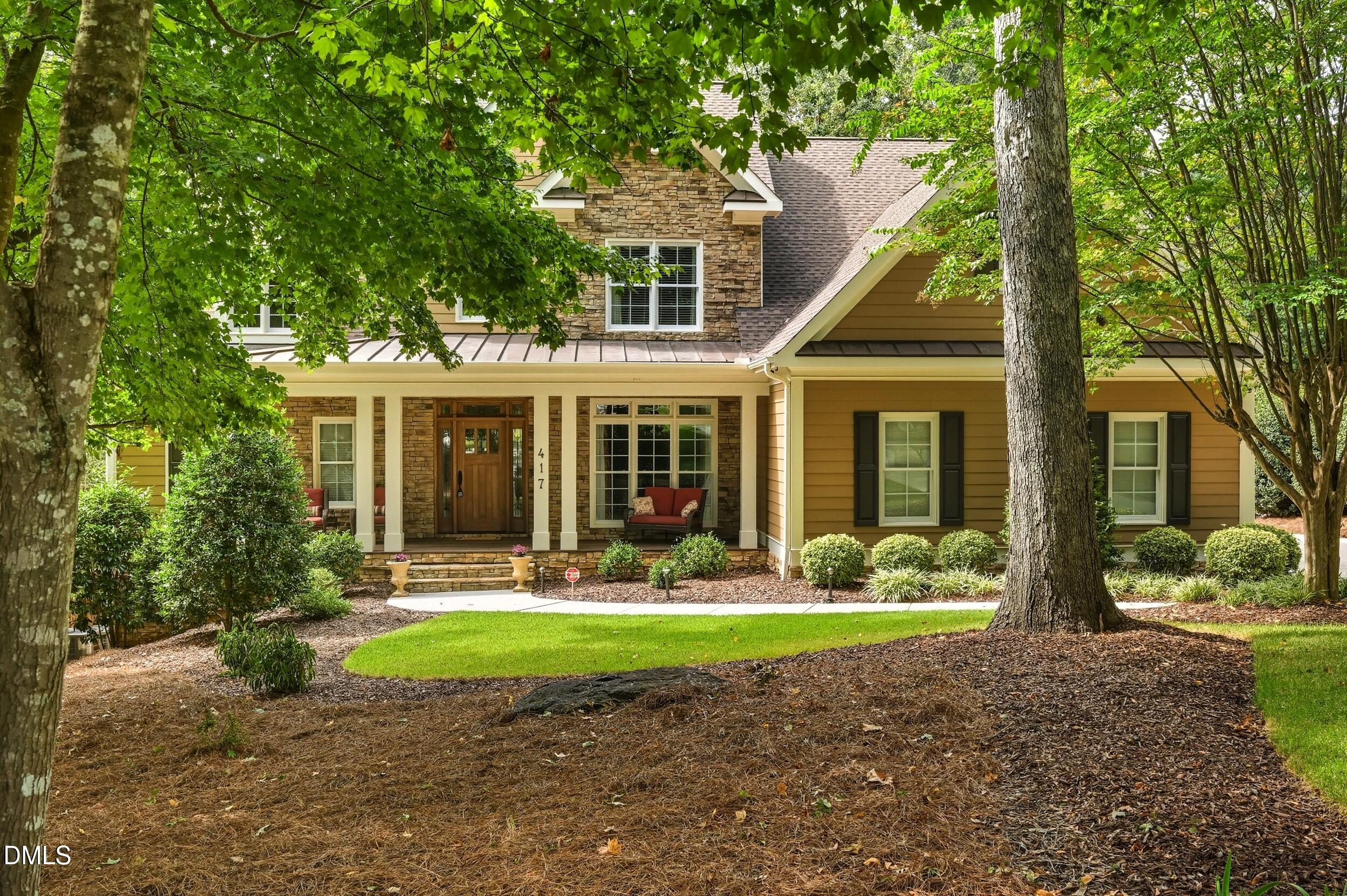 417 The Preserve Trail Chapel Hill, NC 27517 - Photo 2 of 83 a front view of a house with garden