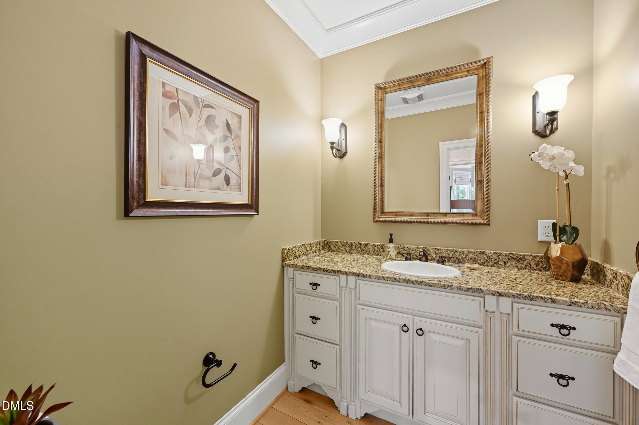 417 The Preserve Trail Chapel Hill, NC 27517 - Photo 34 of 83 a bathroom with a granite countertop sink mirror and vanity