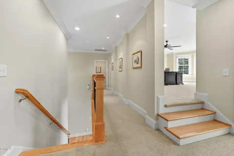 a living room with furniture and large windows
