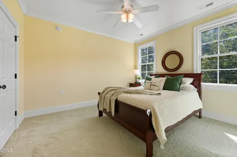 a view of a house with backyard sitting area and garden