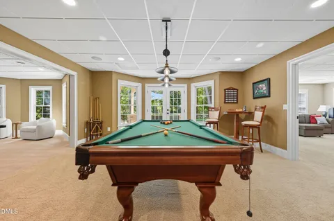 an aerial view of a house with garden space and trees