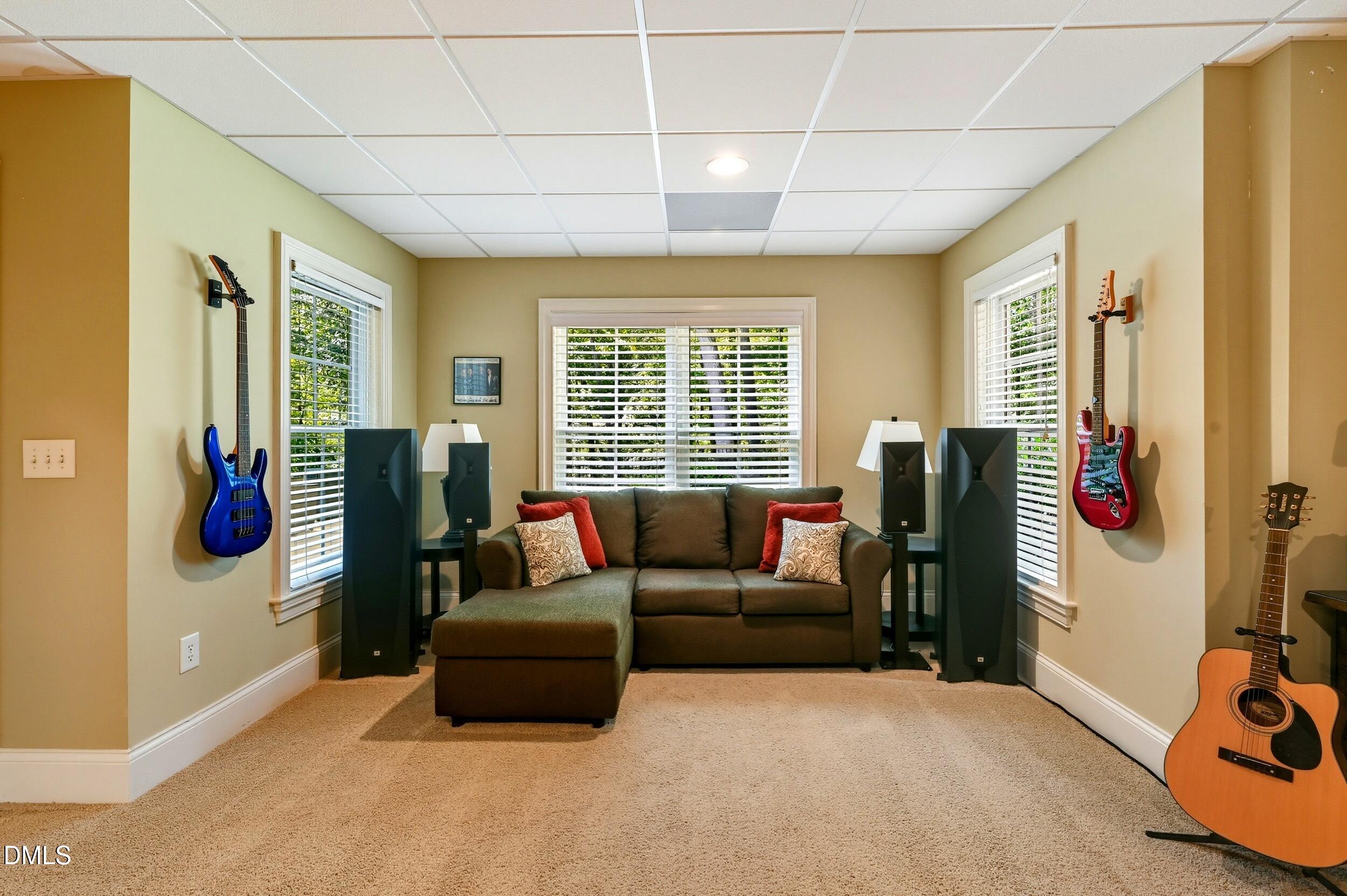 417 The Preserve Trail Chapel Hill, NC 27517 - Photo 57 of 83 a living room with furniture and a flat screen tv
