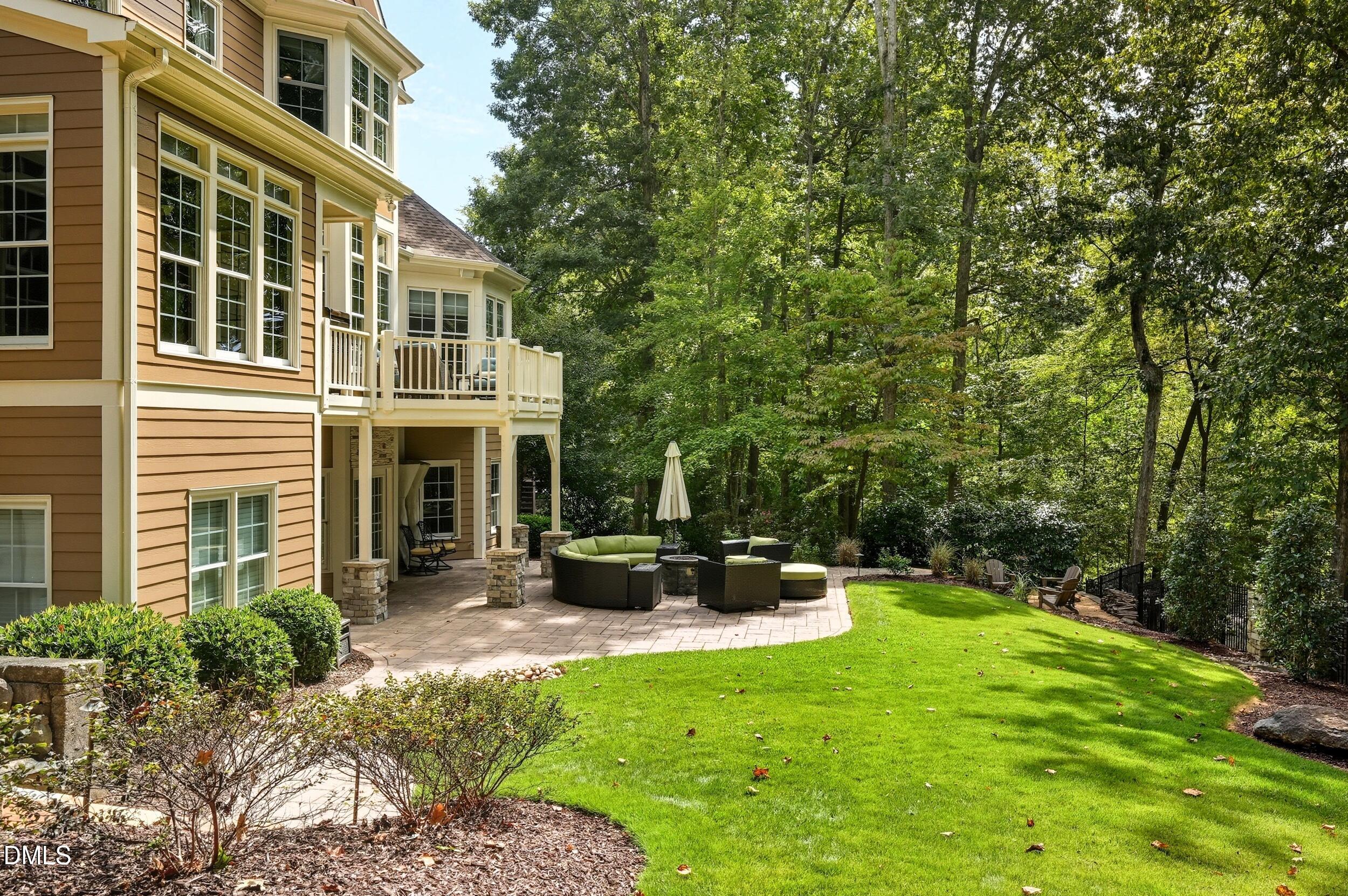 417 The Preserve Trail Chapel Hill, NC 27517 - Photo 68 of 83 a view of a house with backyard sitting area and garden