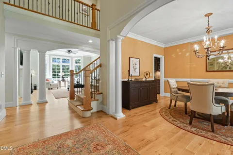 a living room with furniture and a lamp