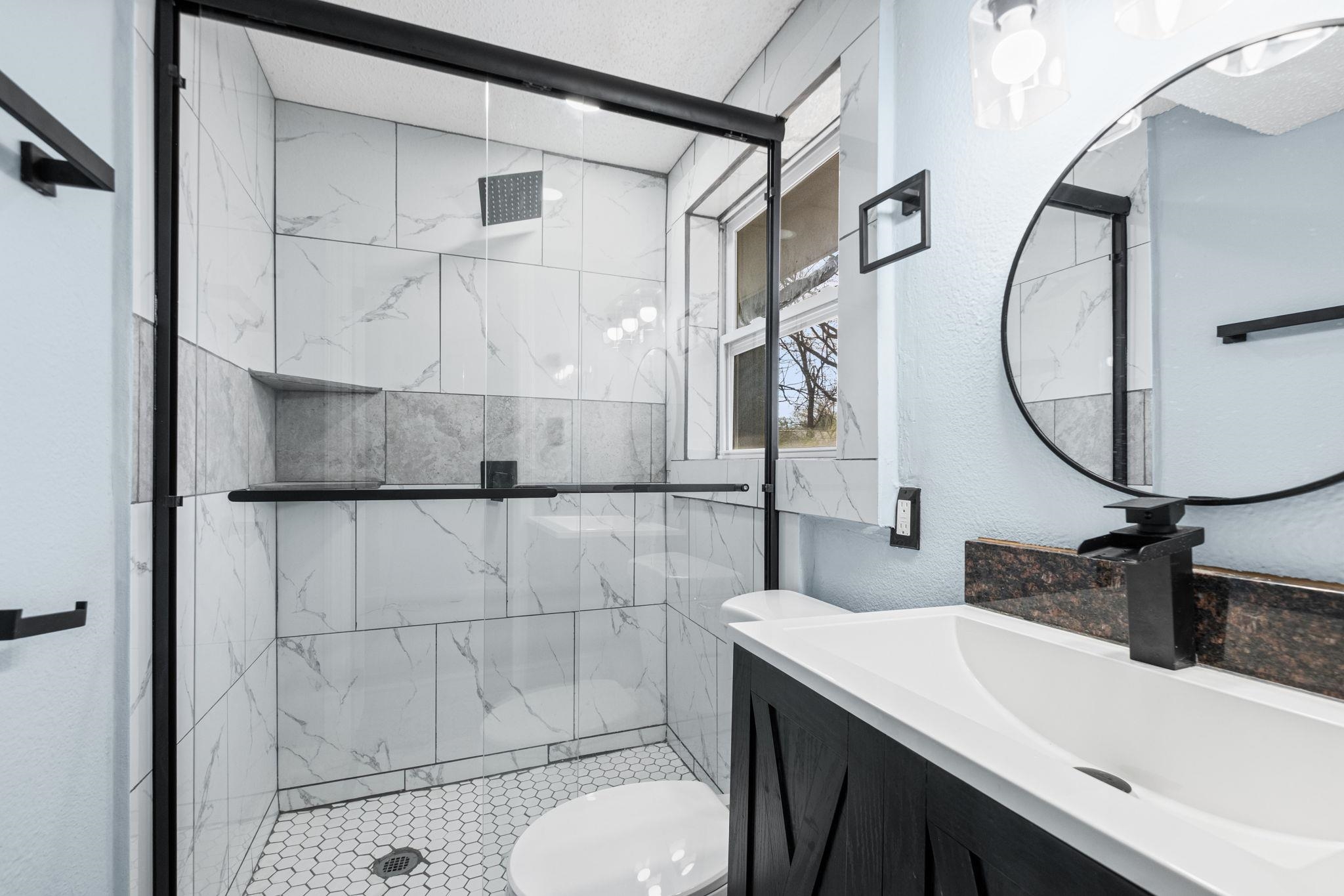 3793 Tessland Road Memphis, TN 38128 - Photo 16 of 22 Full bath featuring vanity, a stall shower, and a textured wall