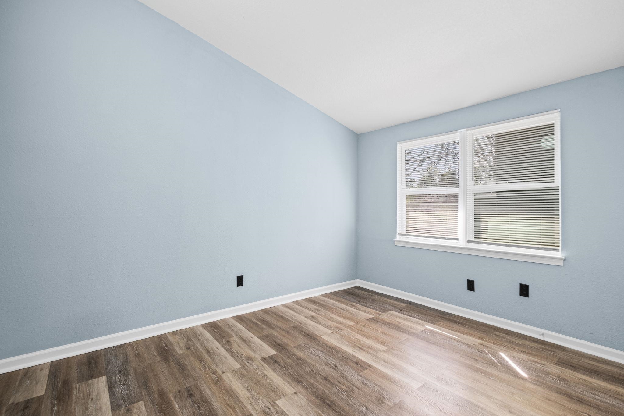 3793 Tessland Road Memphis, TN 38128 - Photo 20 of 22 Empty room featuring light wood-style floors and lofted ceiling
