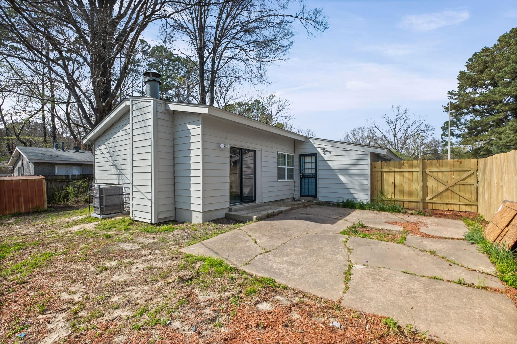 3793 Tessland Road Memphis, TN 38128 - Photo 22 of 22 Back of house with a patio, a chimney, and a gate