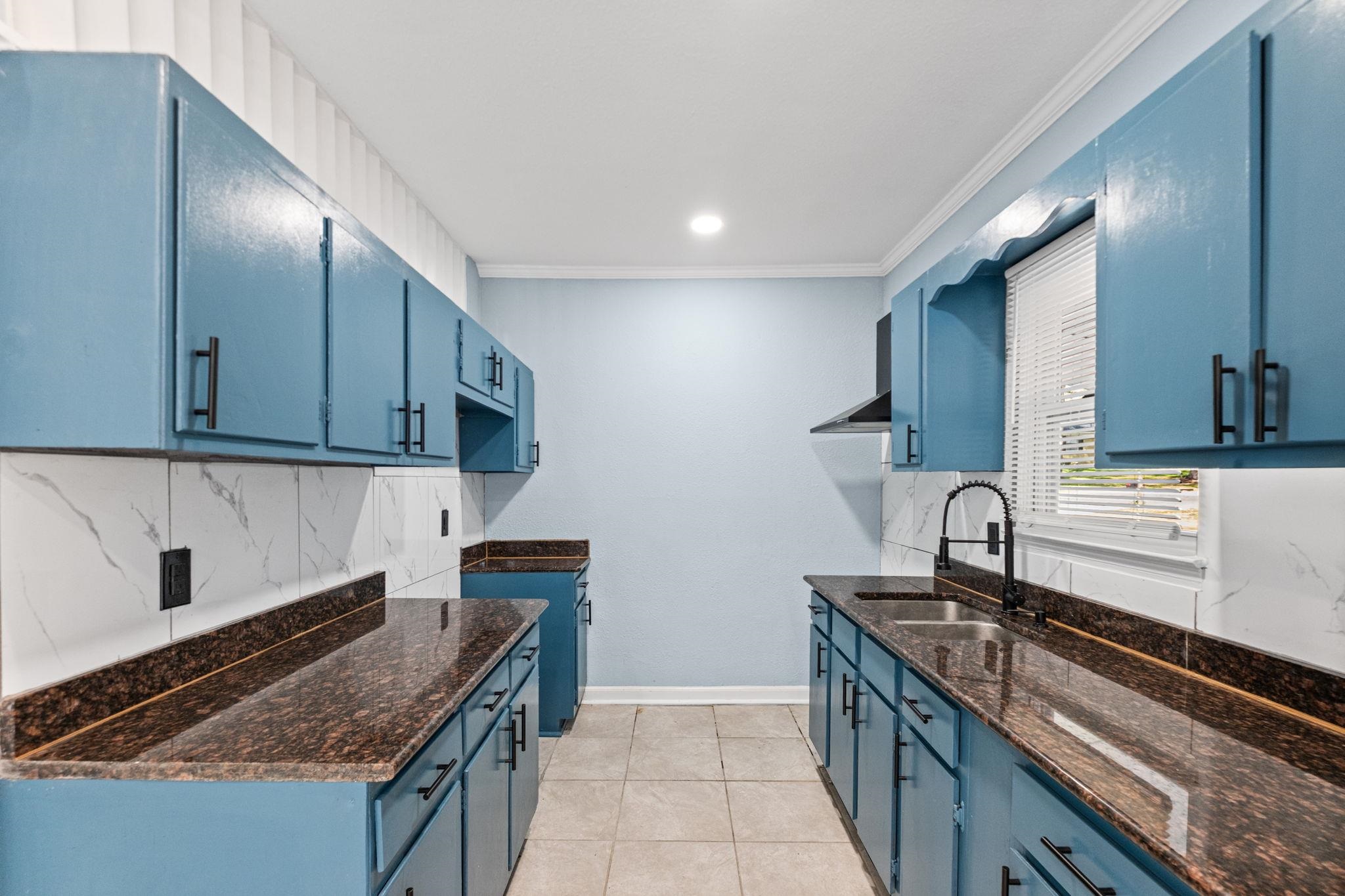 3793 Tessland Road Memphis, TN 38128 - Photo 5 of 22 Kitchen with blue cabinetry, crown molding, light tile patterned flooring, decorative backsplash, and recessed lighting