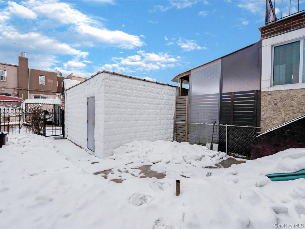 140-17 58th Road Queens, NY 11355 - Photo 23 of 25 a view of snow in front of house