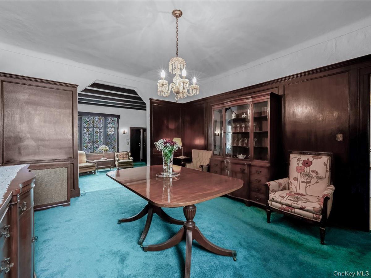 140-17 58th Road Queens, NY 11355 - Photo 6 of 25 a view of a dining room with furniture and window