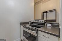 120 Ralph McGill Boulevard Northeast, Unit 1302 Atlanta, GA 30308 - Photo 12 of 28 a close view of a stove and a kitchen counter space