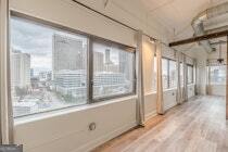 120 Ralph McGill Boulevard Northeast, Unit 1302 Atlanta, GA 30308 - Photo 14 of 28 a view of a bathroom with a glass door and shower
