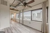 a view of an empty room and a window