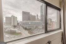 120 Ralph McGill Boulevard Northeast, Unit 1302 Atlanta, GA 30308 - Photo 17 of 28 a bathroom with a bathtub and a shower