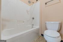 120 Ralph McGill Boulevard Northeast, Unit 1302 Atlanta, GA 30308 - Photo 21 of 28 a white toilet sitting next to a bath tub