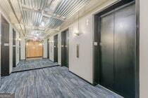 120 Ralph McGill Boulevard Northeast, Unit 1302 Atlanta, GA 30308 - Photo 23 of 28 a view of a hallway with wooden floor