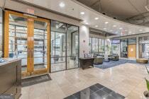 120 Ralph McGill Boulevard Northeast, Unit 1302 Atlanta, GA 30308 - Photo 27 of 28 a view of a hallway with furniture and large windows