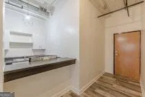 a kitchen with a sink and a refrigerator