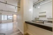a kitchen with a sink and a refrigerator