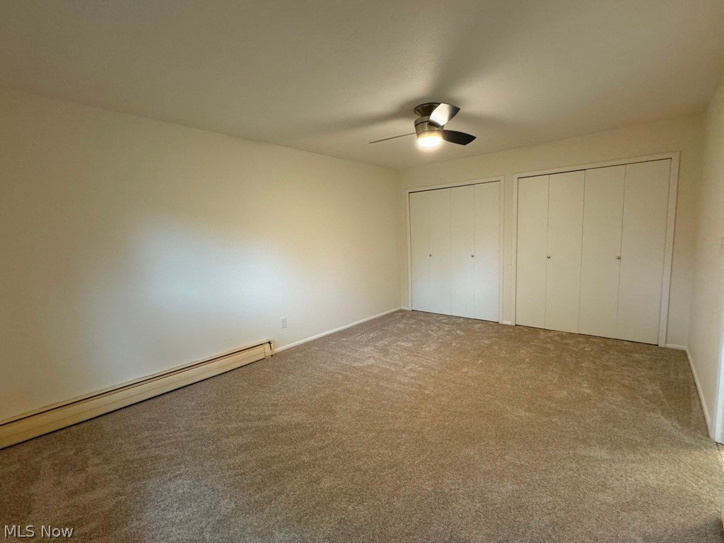 5711 Som Center Road, Unit 29 Solon, OH 44139 - Photo 10 of 15 Oversized bedroom includes double closets, ceiling fan and newer carpeting