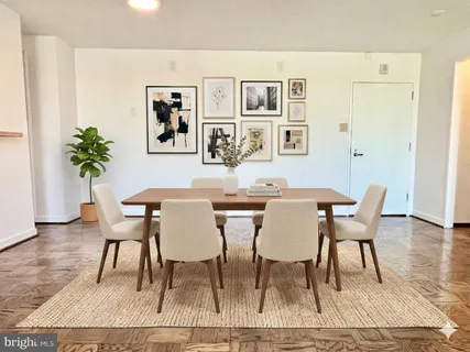 a view of a dining room with furniture and wooden floor