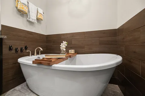 a white bath tub sitting in a bathroom