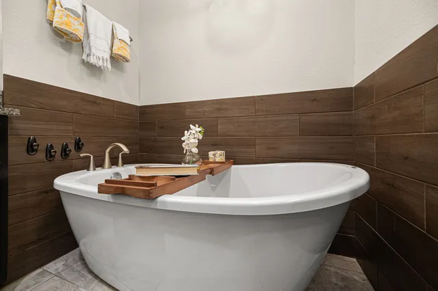 a white bath tub sitting in a bathroom