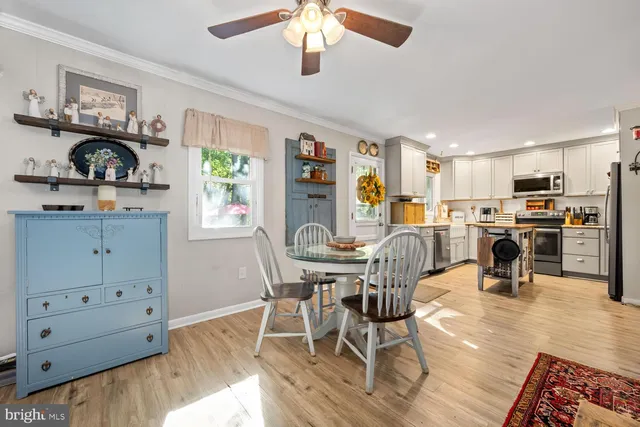 a view of a dining room with furniture and wooden floor