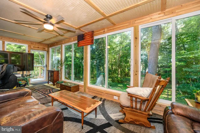 a view of a patio with a dining table and chairs