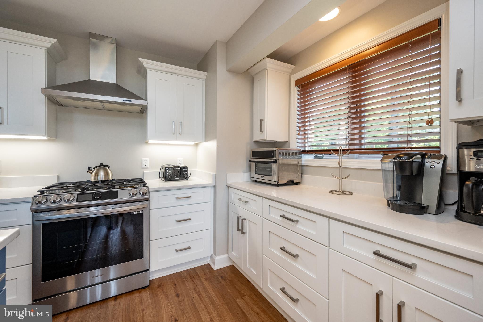 201 Rock Lodge Road McHenry, MD 21541 - Photo 13 of 75 a kitchen with granite countertop white cabinets and white appliances
