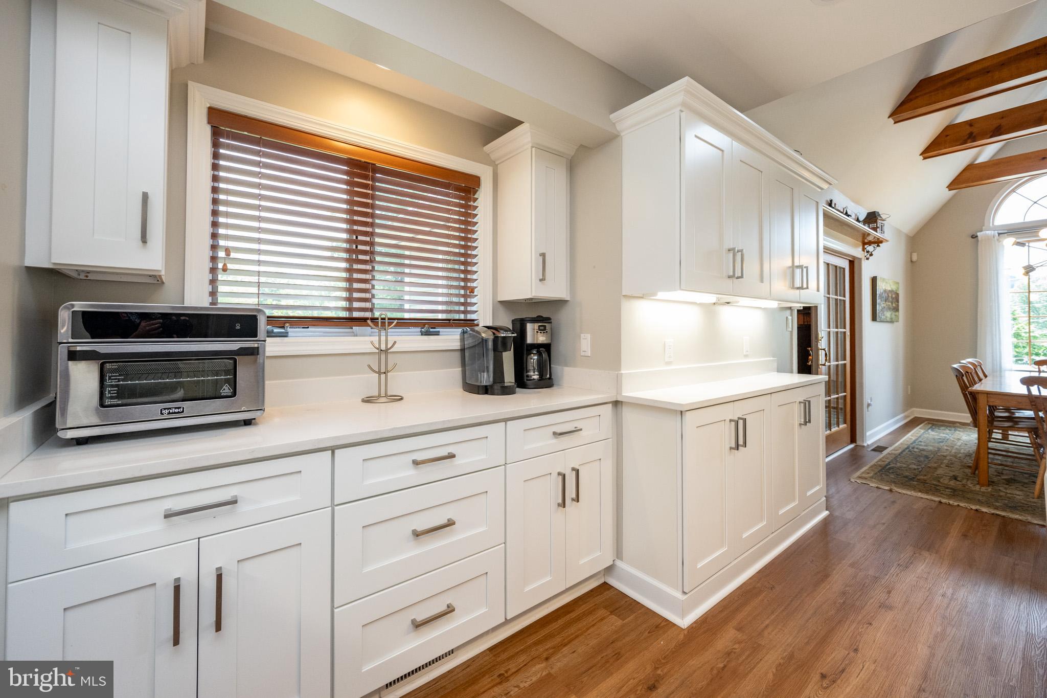 201 Rock Lodge Road McHenry, MD 21541 - Photo 18 of 75 a kitchen with white cabinets and white appliances