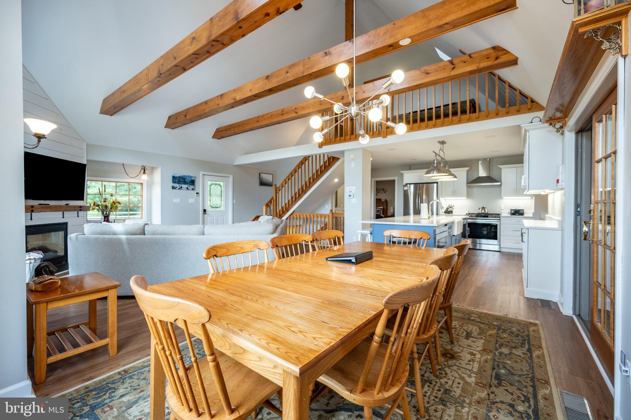 201 Rock Lodge Road McHenry, MD 21541 - Photo 19 of 75 a dining room with furniture and a flat screen tv