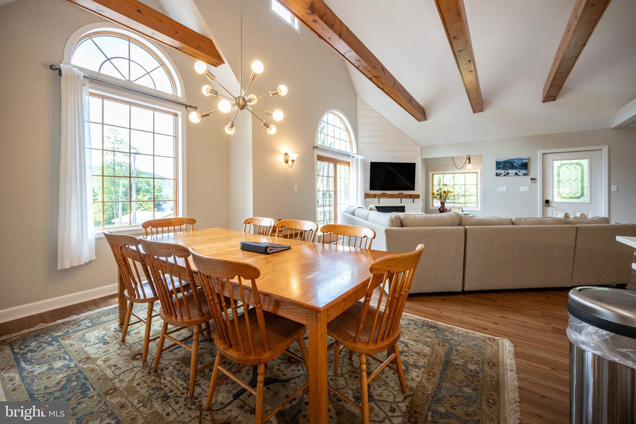 201 Rock Lodge Road McHenry, MD 21541 - Photo 20 of 75 a view of a dining room with furniture and a large window