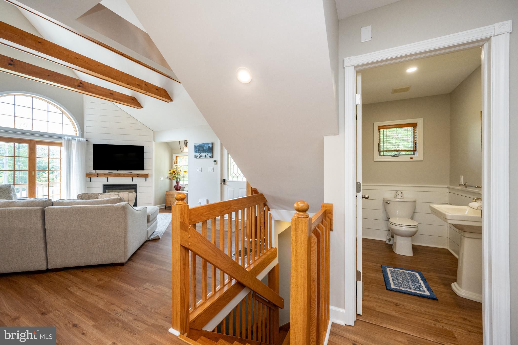 201 Rock Lodge Road McHenry, MD 21541 - Photo 25 of 75 a view of a livingroom with furniture and stairs