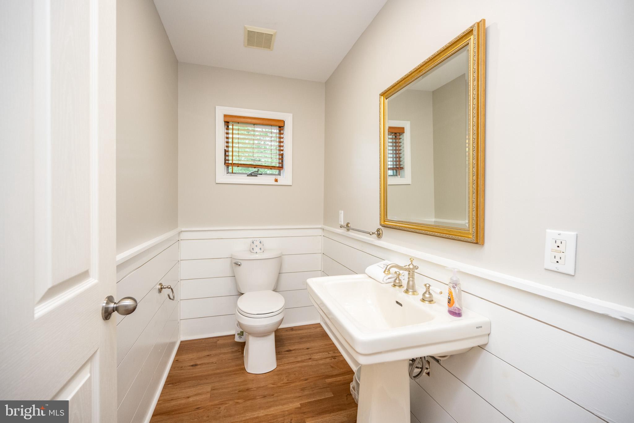 201 Rock Lodge Road McHenry, MD 21541 - Photo 26 of 75 a bathroom with a sink toilet and mirror