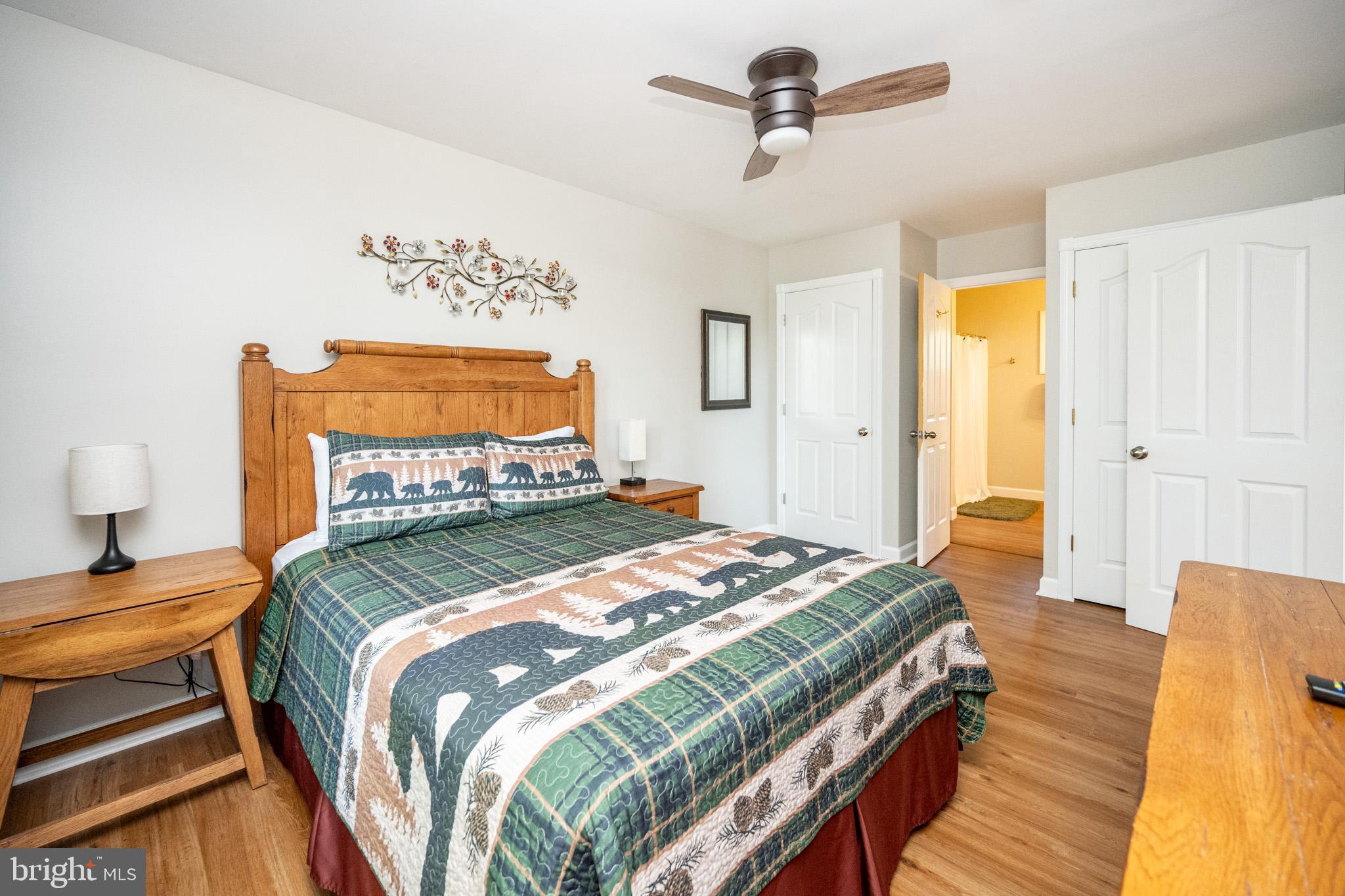 201 Rock Lodge Road McHenry, MD 21541 - Photo 27 of 75 a bedroom with a bed and wooden floor
